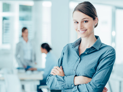 A woman in a modern office, used as a symbolic image to represent accessibility and digital access
